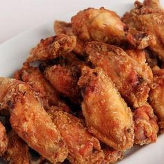 fried chicken pieces on a white plate ready to be eaten