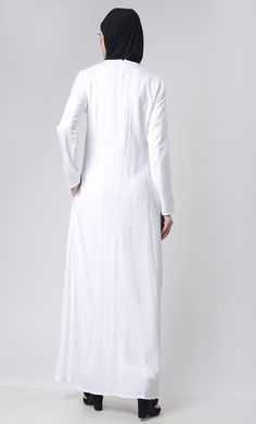 A perfect wardrobe piece for minimalistic style Simple and classy details Round neck Includes both side pockets Front with neck patch with delicate handwork Full Sleeves FABRIC:Rayon CARE: Machine wash cold Formal White Long Sleeve Thobe, White Long Sleeve Thobe For Formal Occasions, Elegant Solid Color Abaya With Modesty Panel, Elegant Workwear Abaya In Maxi Length, Elegant Spring Abaya For Workwear, Fitted Long Abaya With Modesty Panel, Solid Color Maxi Length Abaya For Work, Solid Maxi Length Abaya For Work, Elegant Spring Workwear Abaya