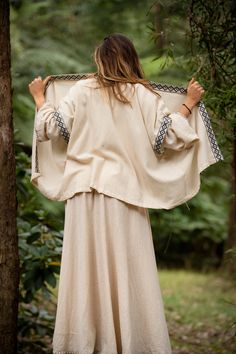 The Rumi Kimono is made with 100% cotton and features a unique, geometric border. This free flowing design is perfect for ceremonies, rituals and a touch of bohemian style. Designed to wrap around for a personal fitting of a wide range of sizes Hand made with Love ❀ Cream Bohemian Long Sleeve Kaftan, Folk Style Cotton Kimono For Spring, Beige Cotton Kimono For Festivals, Bohemian Cotton Kimono For Festival, Cotton Bohemian Kimono For Festival, Cotton Festival Tunic Kimono, Spring Bohemian Kaftan For Traditional Ceremonies, Beige Long Sleeve Cotton Kaftan, Bohemian Cream Shawl Wrap