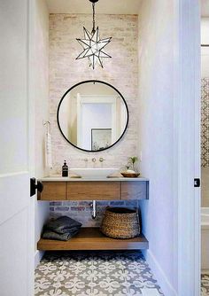 a bathroom with a sink and mirror in it