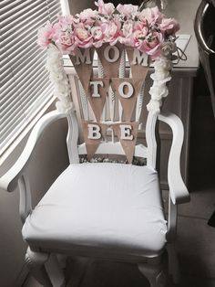 a mom to be chair with flowers on it