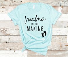 a t - shirt that says, mama in the making with a baby's foot