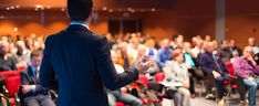 a man standing in front of an audience