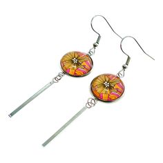 Add some bright color and island vibes to your ensemble with these Happy Hawaiian Long Bar Earrings. Vibrant stripes of yellow and pink combined with soft flower petals adorn these exotic ear charms. These dangles are small and light at .5 inches wide, but they are also graceful at 3 inches long. This statement pair features a round 14mm Photo Glass Cabochon Center with a brilliant tropical floral design. These boho beauties are made from 100% Stainless Steel and are sure to stay snug in your ea Long Bar Earrings, Art Glass Jewelry, Crystal Chandelier Earrings, Boho Beauty, Butterfly Earrings Stud, Shell Decor, Cabochon Jewelry, Jewelry Safe, Custom Tags