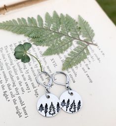 Rustic Tree Earrings, Nature Tree Dangle Earrings, Hypoallergenic Ear Jewelry, Forest Jewelry, Nature Lover Gift, Hiker Gifts, Outdoors Gift Rustic tree earrings!! Great gift idea for nature lovers, hikers, campers, forest rangers, mountain lovers and much more!! These earrings are made with round silver aluminum charms metal stamped with 3 different tree types (4 total trees) on each one. They are attached to stainless steel lever back ear wires.  These earrings are extremely lightweight and ar Nature-inspired Dangle Hoop Earrings As Gift, Nature-inspired Dangle Hoop Earrings For Gift, Nickel-free Nature-inspired Earrings As Gift, Nature-inspired Dangle Hoop Earrings, Nickel-free Nature-inspired Earrings For Gift, Hypoallergenic Nature-inspired Round Earrings, Everyday Nickel Free Stainless Steel Earrings, Everyday Nickel-free Stainless Steel Earrings, Everyday Stainless Steel Nickel-free Earrings