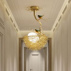 the hallway is decorated in white and gold with two birds perched on it's branches