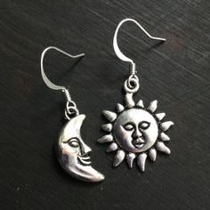 Tibetan silver sun and moon charms, on silver plated brass fishhooks. ..: V I E W   S H O P:.. www.lotusfairy.etsy.com www.shopEarthshine.com ..: P O L I C I E S :.. Please see the drop down FAQs menu All items are FINAL SALE. ★ I M P O R T A N T ★ This product is not intended to be used by, or around,  anyone under the age of 13.  ShopEarthshine.com ★ lotusfairy.etsy.com  Canadian buyers:  Prices shown include GST/HST. Adjustable Sun And Moon Sterling Silver Earrings, Adjustable Sterling Silver Earrings With Sun And Moon Design, Silver Sun And Moon Drop Earrings, Adjustable Sterling Silver Sun And Moon Earrings, Sterling Silver Sun And Moon Adjustable Earrings, Silver Sun And Moon Design Drop Earrings, Sterling Silver Sun And Moon Dangle Earrings, Silver Symbolic Earrings With Sun And Moon Design, Silver Earrings With Sun And Moon Design - Symbolic