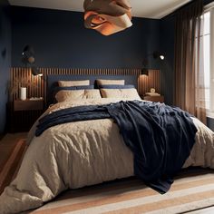 a bedroom with blue walls and beige bedding