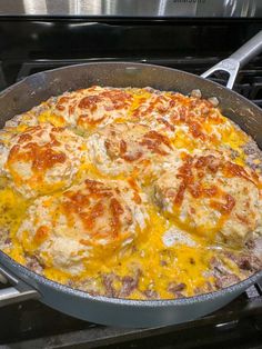 a pan filled with food sitting on top of a stove