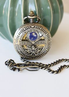 "This pocket watch can be purchase with or without engravings. Engraving will be on back glass of the pocket watch. Great gift for everyone even yourself ! Our elegant steampunk victoriana pocket watch has elegant carved case design. Diameter of the watch is 1-3/4\". Watch is mechanical, please wind it after arrival. Setting the time You will need to grasp the crown (button at the top) tightly and pull. When you hear a click you will be able to turn the crown/button to set the time. Once you hav Pocket Watch Drawing, Elegant Steampunk, Groom Watch, Groomsmen Watches, Watch Drawing, Workout Routines For Beginners, Unique Pockets, Mechanical Pocket Watch, Groom Groomsmen