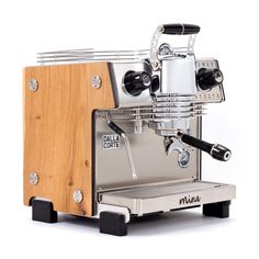 an espresso machine sitting on top of a wooden stand