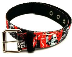 a red and black belt with skulls on it