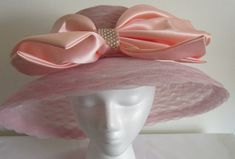 Wedding Hats With Bow And Short Brim, Formal Wide Brim Hat With Ribbon, Formal Hat With Ribbon And Curved Brim, Elegant Evening Hat With Satin Bow, Elegant Wedding Hats With Ribbon, Elegant Hat With Satin Bow For Party, Elegant Wedding Hats With Satin Bow, Formal Hat With Adjustable Bow, Elegant Party Hat With Satin Bow