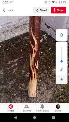 an image of a wooden pole with fire painted on it's side and the word save below