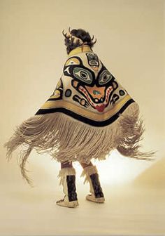 a person in an animal costume standing on one leg and wearing boots with their legs spread out