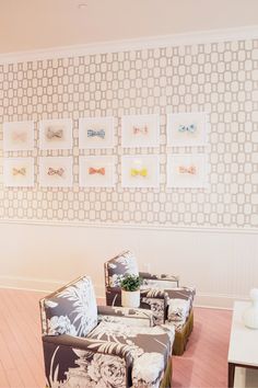 a living room filled with furniture and pictures on the wall