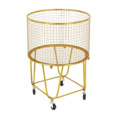 a gold metal wire basket on wheels