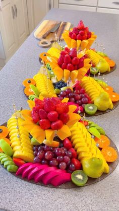 the fruit is arranged on top of each other in different shapes and sizes for display