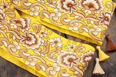 The richness of colors in this trim will carry you away to a field of autumnal flowers. Beautifully regal and bold flowers blossom in gorgeous metallic and neutral shades against a bold yellow background. I hand-select these beautifully embroidered silk trims from a huge storehouse in India. It is 7 floors of color and texture. I'm like a kid in a candy shop over these beauties- the colors are overwhelming! Traditionally used as Sari borders, but the adornment possibilities are endless! Tableclo Patchwork Sewing, Wedding Crafts Diy, Burlap Ribbon, Gold Silk, Bohemian Floral, Wedding Crafts, Shopping World, Green Ribbon, Blossom Flower