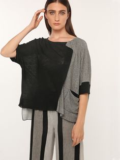 A relaxed, swingy silhouette, a high scoop neck and dropped shoulders in a beautifully lightweight linen. Features black and grey contrasting fabrics that softly meet with a draped neck detail and side pocket. The flowy body and high-low hemline of this top pair perfectly with your favorite wide leg pant or maxi skirt. Versatile Black Linen Top, Linen Lagenlook Top With Asymmetrical Hem, Lagenlook Linen Tops With Asymmetrical Hem, Modern Black Linen Tops, Wide Leg Pant, Side Pocket, Modern Woman, High & Low, Wide Leg Pants