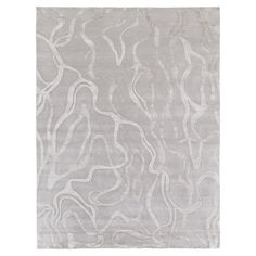 a gray rug with wavy lines on it