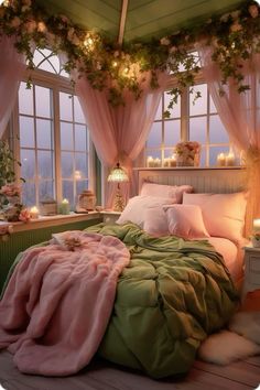 a bed with pink and green sheets in front of a window filled with candles on the windowsill