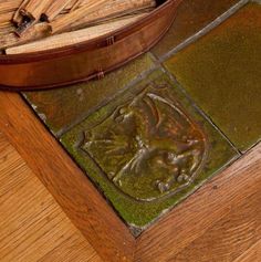 a close up of a wooden box on a table with wood shavings in it