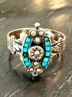 10k ring Victorian, genuine calibrated natural square Turquoise and seed pearls, circa 1880s.  Condition is very good for its age any slight wear commensurate with age, pictures show the details.  Size 5 1/2, a little over 1/2" north to south on finger, wt.- 3.9 grams.  Turquoise a favorite gem of the Victorian, symbolic of good life, vitality and wisdom.  A favorite stone in all cultures and times with good reason, it's beauty is serene and colorful. Victorian Turquoise Jewelry For Anniversary, Turquoise Victorian Jewelry For Anniversary, Antique Turquoise Ring For Anniversary, Victorian Turquoise Rings As Gifts, Victorian Turquoise Rings For Gift, Turquoise Victorian Rings For Gift, Victorian Ring, Victorian Rings, Seed Pearl