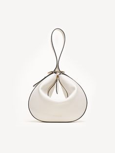 Convenience is queen when it comes to The Evelina. With a beautiful, half-moon shape in supple Italian tumbled calf leather, she can easily be converted from a traditional shoulder bag to a trendy wristlet. Day to night in an instant! Chic Clutch With Adjustable Strap And Top Handle, Chic Top Handle Clutch With Adjustable Strap, Modern Evening Bag With Handle Drop, Modern Top Handle Clutch With Mobile Phone Bag, Modern Clutch With Top Handle For Mobile Phone, Chic Clutch Evening Bag With Handle Drop, Versatile Evening Bag With Detachable Handle, Modern Clutch With Top Handle And Mobile Phone Bag, Chic Clutch With Round Handle