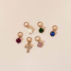 Adorn your favorite hoops with a touch of sparkle to your everyday look. Mix and match your ear-stack with tiny charms to get even more out of your staple hoops. Swap it out any time for an entirely new look. 14K Gold Ruby Stone DOES NOT FIT ALL EARRINGS, shop all matching earrings / singles Jumpring Inner Diameter 2.2mm Gemstone diameter 3mm #CS055 Tiny Charms, Tiny Cross, Tiny Charm, Ear Stack, Get Even, Ruby Stone, Cross Earrings, Emerald Stone, Sapphire Stone