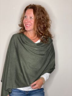 An all time best seller, the Eden Poncho is simple, versatile and practical, this poncho is spun from a lightweight wool blend. In a one size fits all cut, this style is flattering for all women. From the young mom, to the stylish grandmother, to the free spirited daughter, the Eden Poncho will live in your closet for seasons to come. 8% Mercerized Wool | 50% Acrylic | 42% Nylon Green Shawl For Fall, Green Casual Shawl For Fall, Casual Green Shawl For Fall, Green Shawl Poncho For Fall, Oversized Green Cape For Fall, One Size Cashmere Poncho For Fall, One Size Cashmere Wraps For Fall, One Size Cashmere Poncho For Layering, Casual Green Long Sleeve Poncho