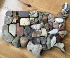 a pile of rocks sitting on top of a wooden floor