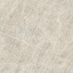 a white marble textured surface with no visible lines or markings on it, as well as the top part of the floor