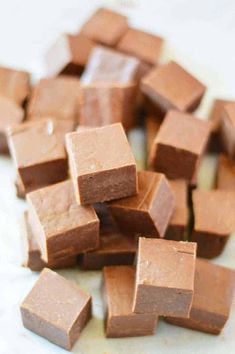 a pile of chocolate cubes sitting on top of a counter