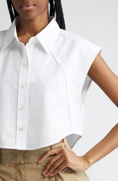 Piping-trimmed raised seams accentuate the unique tailoring of this cropped shirt marked with a flocked Wang-square logo. 19" length (size Medium) Front button closure Point collar Sleeveless, with extended shoulders Curved hem 100% cotton Dry clean Imported Blouses Sleeveless, Logo Shirts For Women, Tailored Shirts For Women, Cropped Shirt Women, Collared Top, Interesting Collars, Shirt Button, Shirt Collar Blouse Designs