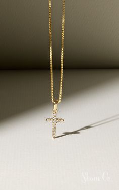 Celebrate Easter with this darling cross necklace. This sparkling cross is made up of 12 round diamonds. These hand-selected gems are set in quality 14k yellow gold, and the dazzling design hangs from a matching 18″ box chain. Article number: 41068462 Gold Cross Pendant Necklace With Box Chain, Elegant Cross Necklace With Box Chain For Gift, Yellow Gold Cubic Zirconia Cross Necklace, Elegant Cross Necklace With Box Chain, Jewellery Photography, Diamond Bar Necklace, Photo Products, Earthy Jewelry, Jewelry Board