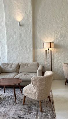 a living room with white walls and furniture