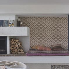 a living room filled with furniture and a fire place