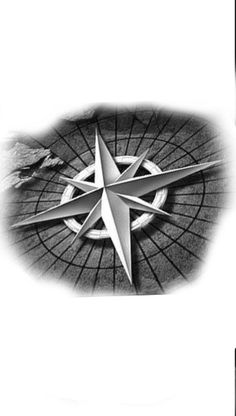 a black and white photo of a compass