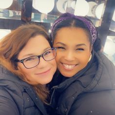 two women are taking a selfie in front of the camera with their arms around each other