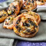 several small pastries sitting on top of a cloth