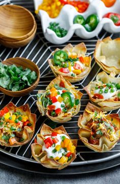 small appetizers are sitting on a grill, ready to be eaten and served