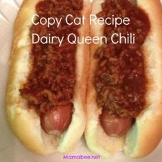 two hotdogs with chili on them sitting in a paper container that says copy cat recipe dairy queen chili