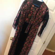 Machine Made Black Velvet With Red And Other Color Embroidery. Comes With Matching Belt. Previously Worn But In Excellent Condition. Bust 42 Inches Sleeve Length 21 Inches Shoulder To Floor 58 Inches Color Embroidery, Black Velvet, Long Sleeve Dress, Velvet, Sleeve Length, Womens Dresses, Embroidery, Long Sleeve, Red