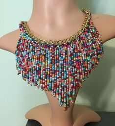 Bold beaded drop rainbow beaded statement necklace with adjustable chain and lobster claw closure. Beautiful colors, medium weight, statement piece. Multicolor Beaded Choker With Dangling Beads, Multicolor Beaded Chain Dangle Necklace, Adjustable Multicolor Beaded Dangle Necklaces, Multicolor Necklaces With Dangling Beads, Multicolor Beaded Necklace With Dangling Beads For Party, Multicolor Bohemian Beaded Necklace, Multicolor Dangling Beads Necklaces, Multicolor Beaded Necklaces With Dangling Beads, Multicolor Dangling Beaded Necklace