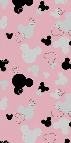 mickey mouse wallpaper in pink and black with white clouds on the bottom right side