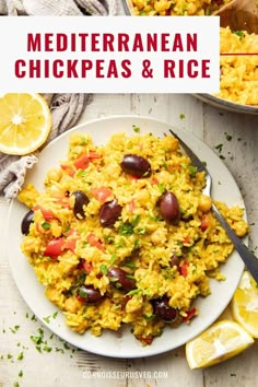 mediterranean chicken and rice on a white plate with lemon wedges next to the bowl