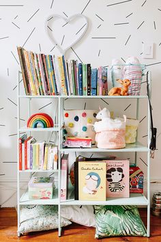 a bookshelf filled with lots of children's books