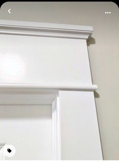 the corner of a door is painted white