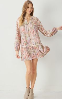 The sweetest dress silhouette. Featured in a mixed floral print design, a v-neckline, long sleeves, and trim detail throughout. This woven mini dress is lightweight and a must-have! Perfect for dressing up to an event or styling for every day with some fun earrings. blush floral print woven mini dress long sleeves lined trim detail throughout fits true to size 100% polyester Model is 5'10" and wearing size Small. Long Sleeve Floral Dress For Brunch, Long Sleeve Ditsy Floral Dress For Spring, Long Sleeve Floral Print Spring Dress, Spring Floral Long Sleeve Dress For Brunch, Spring Long Sleeve Floral Dress For Brunch, Long Sleeve Floral Print Dresses For Spring, Floral Print Long Sleeve Dress For Spring Brunch, Long Sleeve Floral Print Dress For Spring Brunch, Feminine Flowy Floral Dress With Long Sleeves